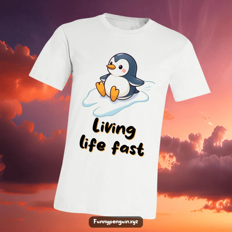 Funny t-shirt depicting a small penguin joyfully sliding down an icy hill, flippers outstretched, embodying winter fun, a great funny gift.